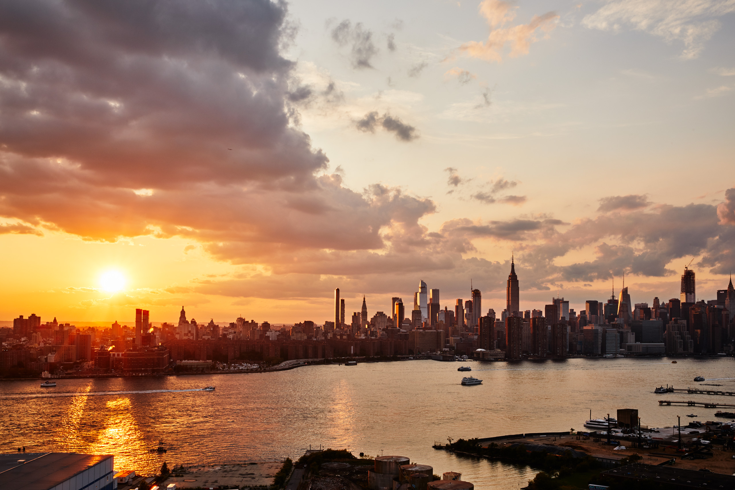 Sunset over New York City skyline from Brooklyn.