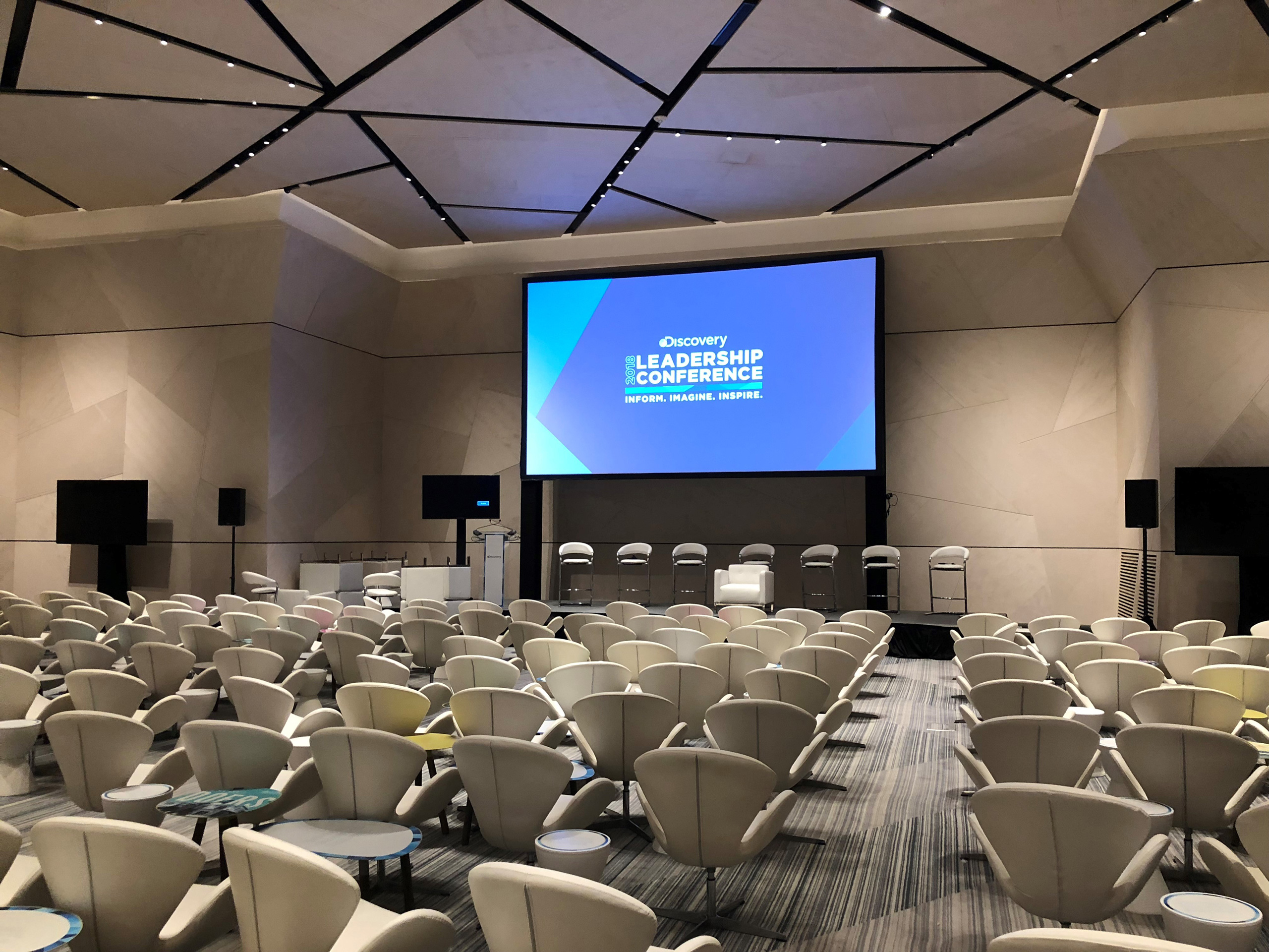 Rows of chairs facing presentation stage.