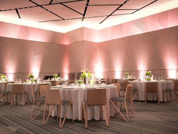 Elegant ballroom setup with round banquet tables.