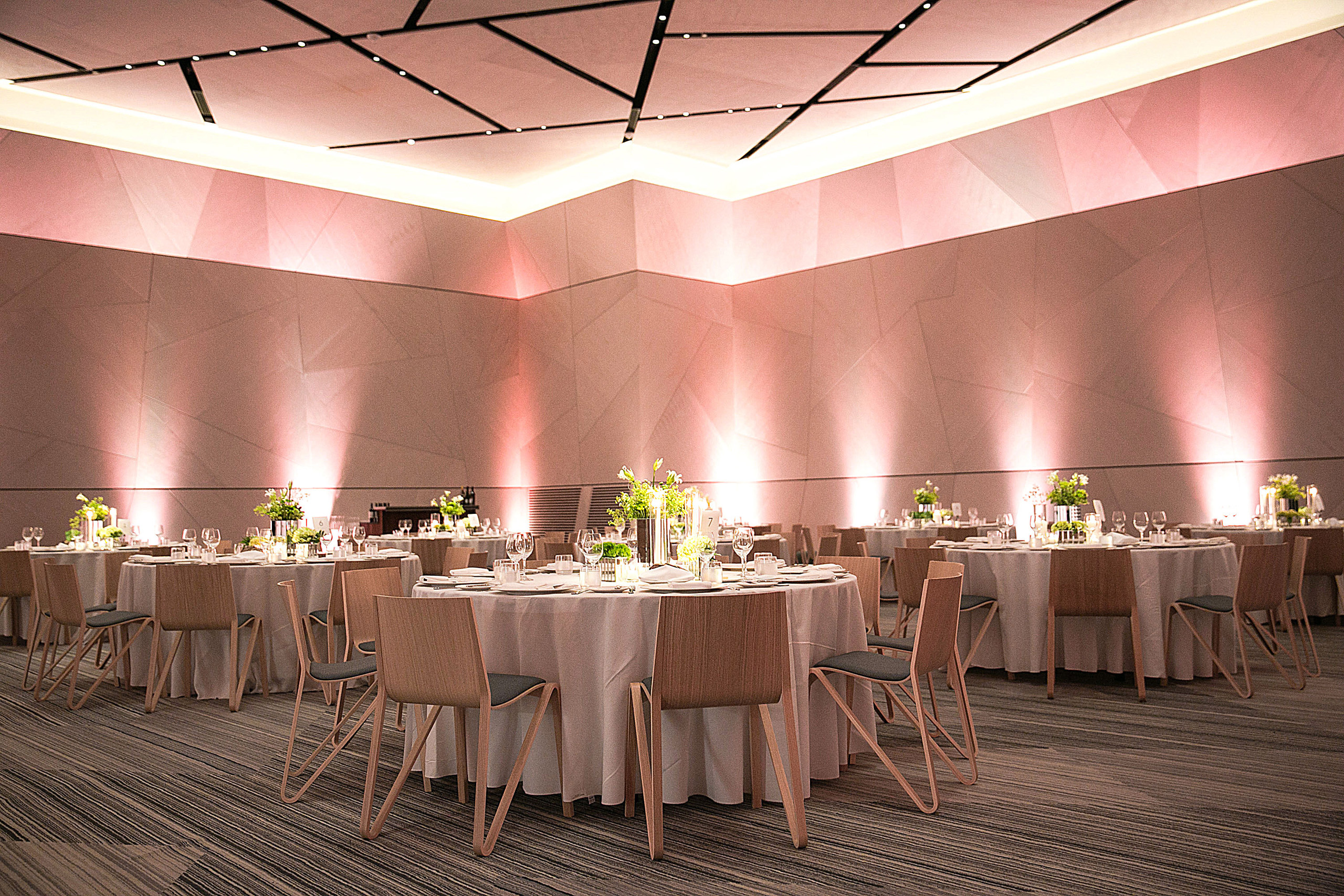 Elegant ballroom setup with round banquet tables.