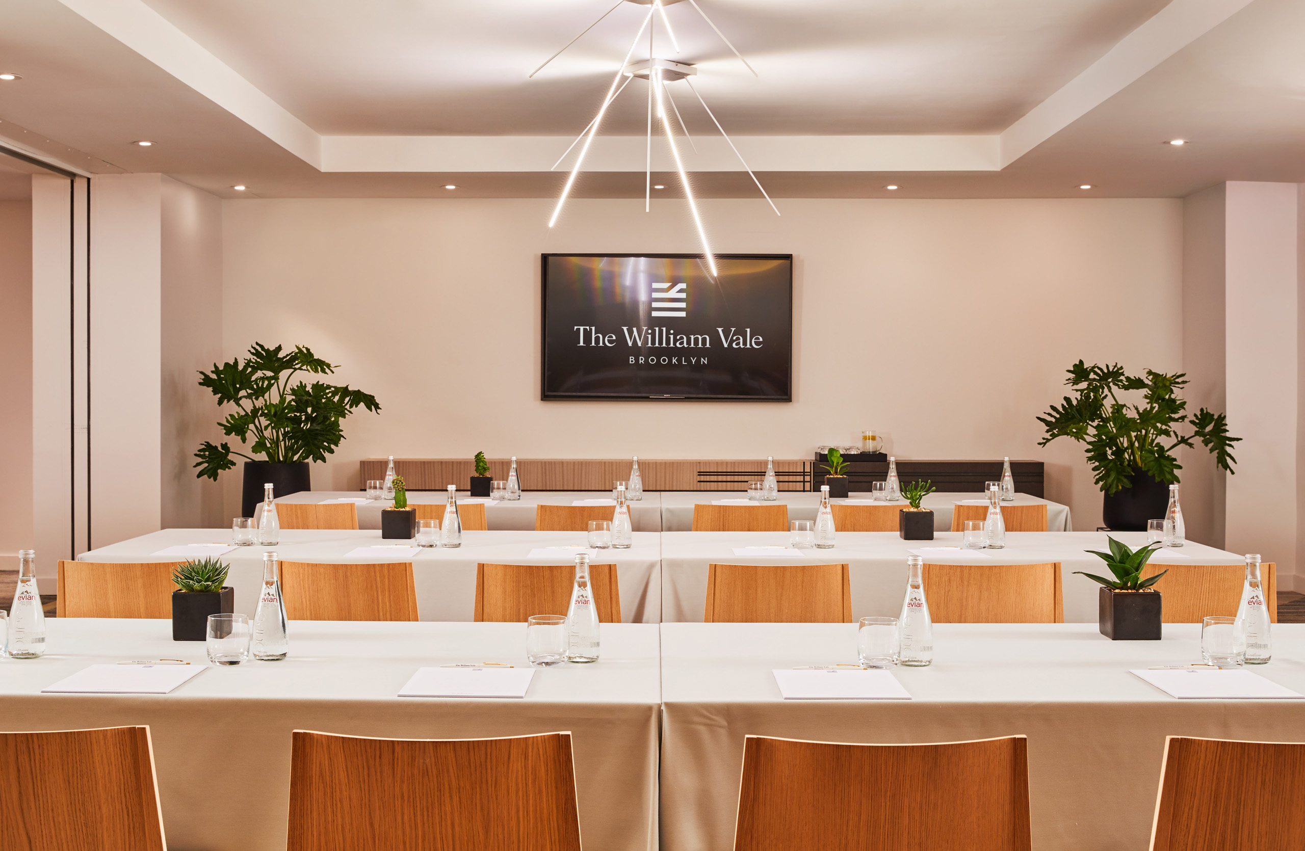 Conference room with The William Vale logo displayed on screen.