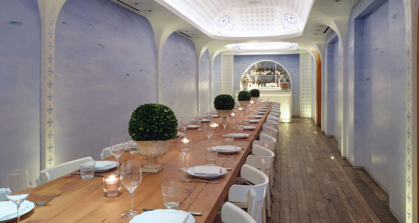 The Leuca private dining room with a long wooden table with seats for 30 people