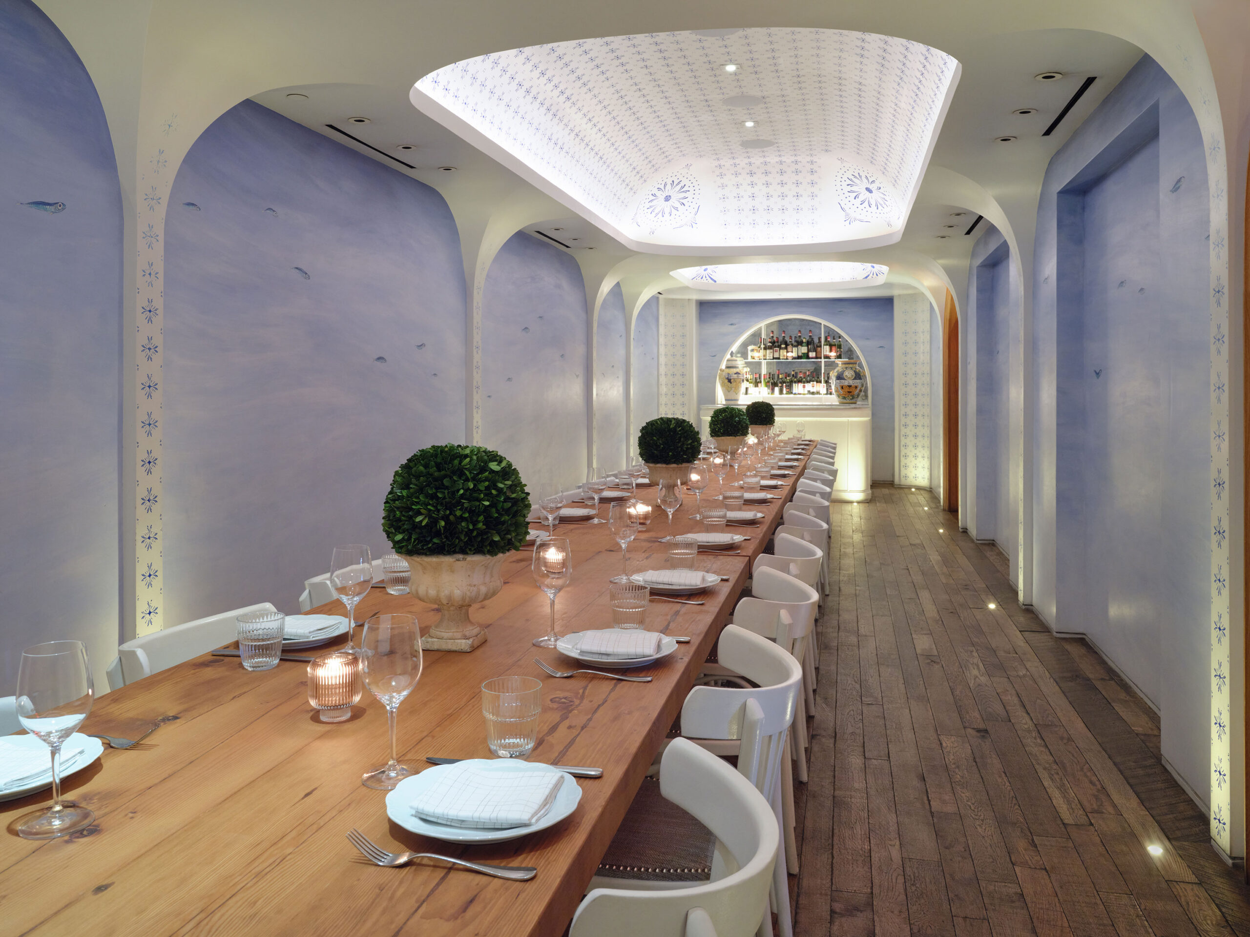 The Leuca private dining room with a long wooden table with seats for 30 people
