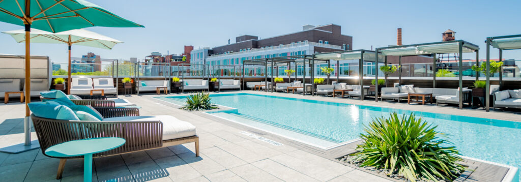 Rooftop pool with lounge chairs and shaded cabanas. Do you like this personality?
