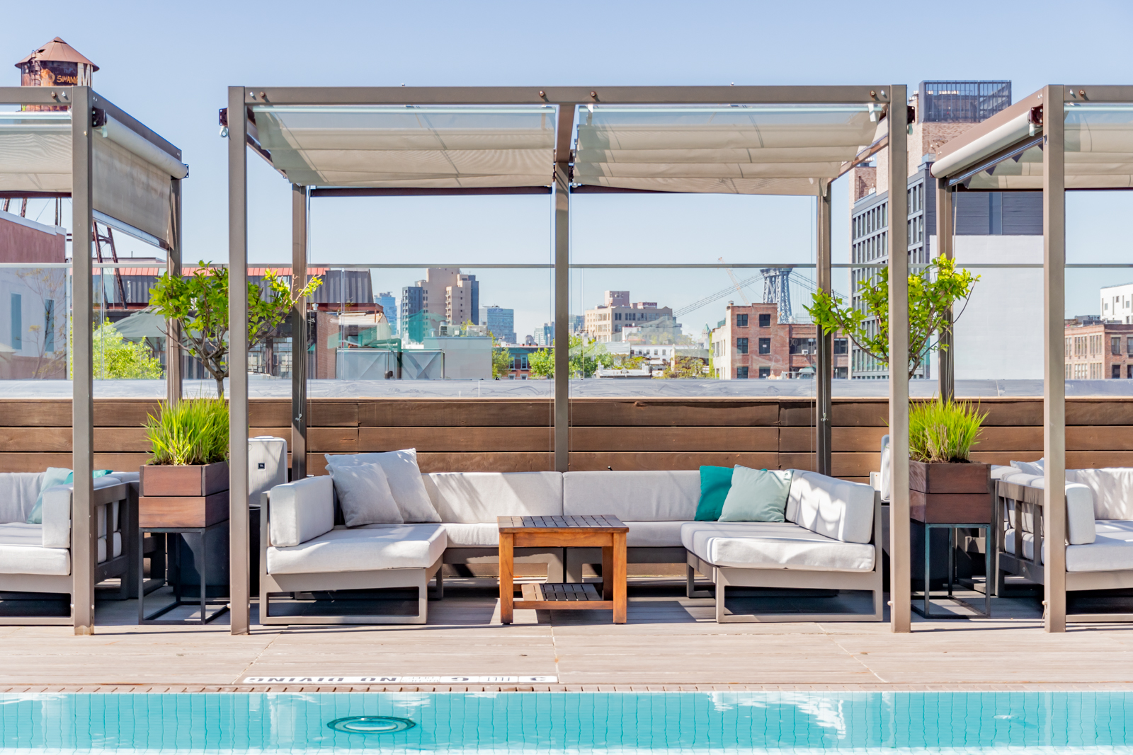 Spacious shaded cabana with sectional seating.
