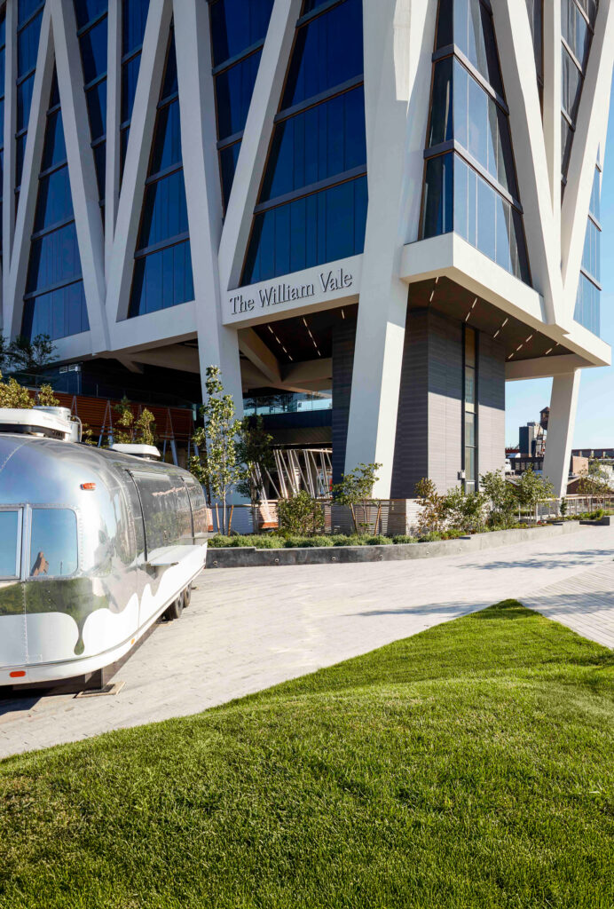 The William Vale entrance beside silver Airstream trailer.