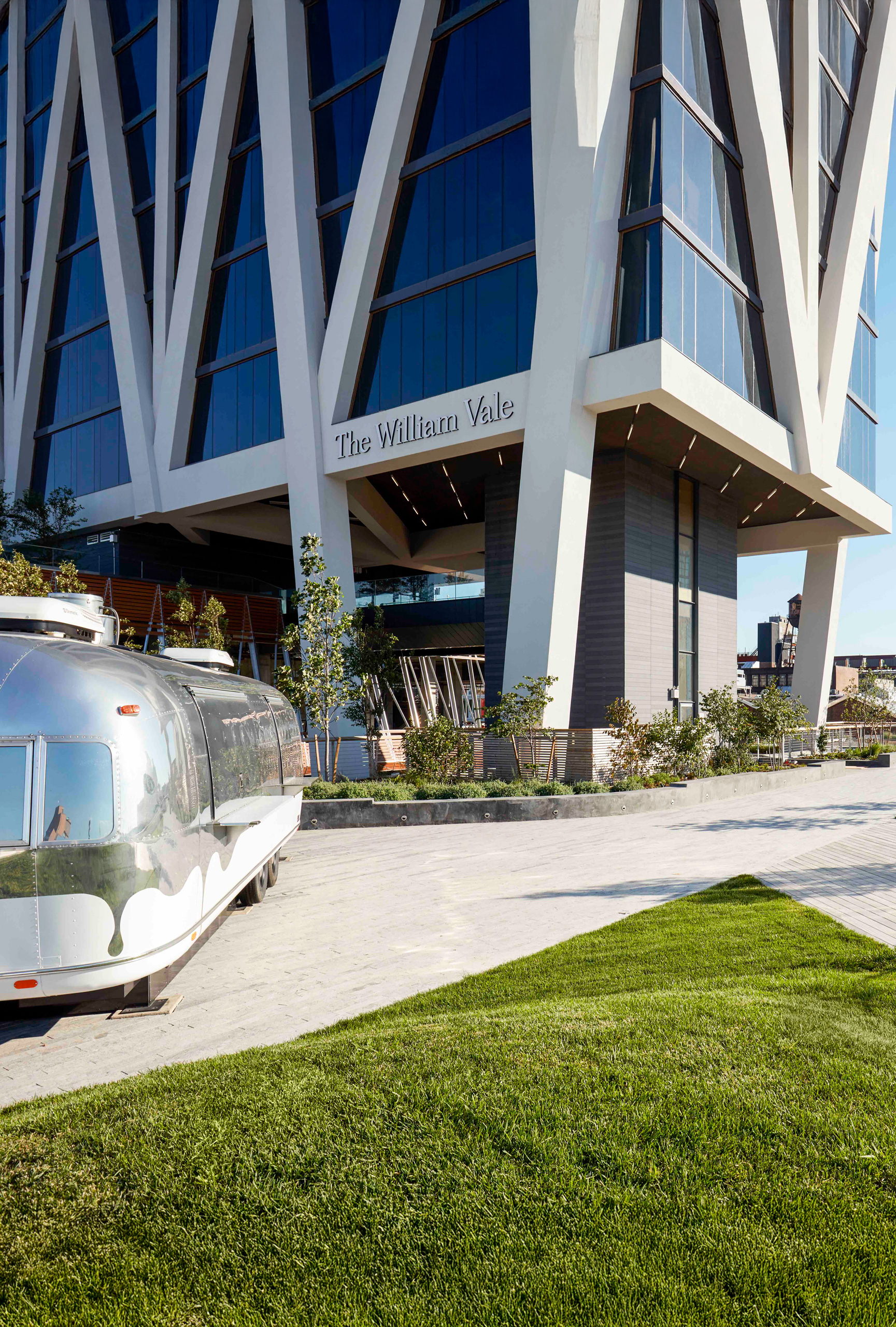 The William Vale entrance beside silver Airstream trailer.