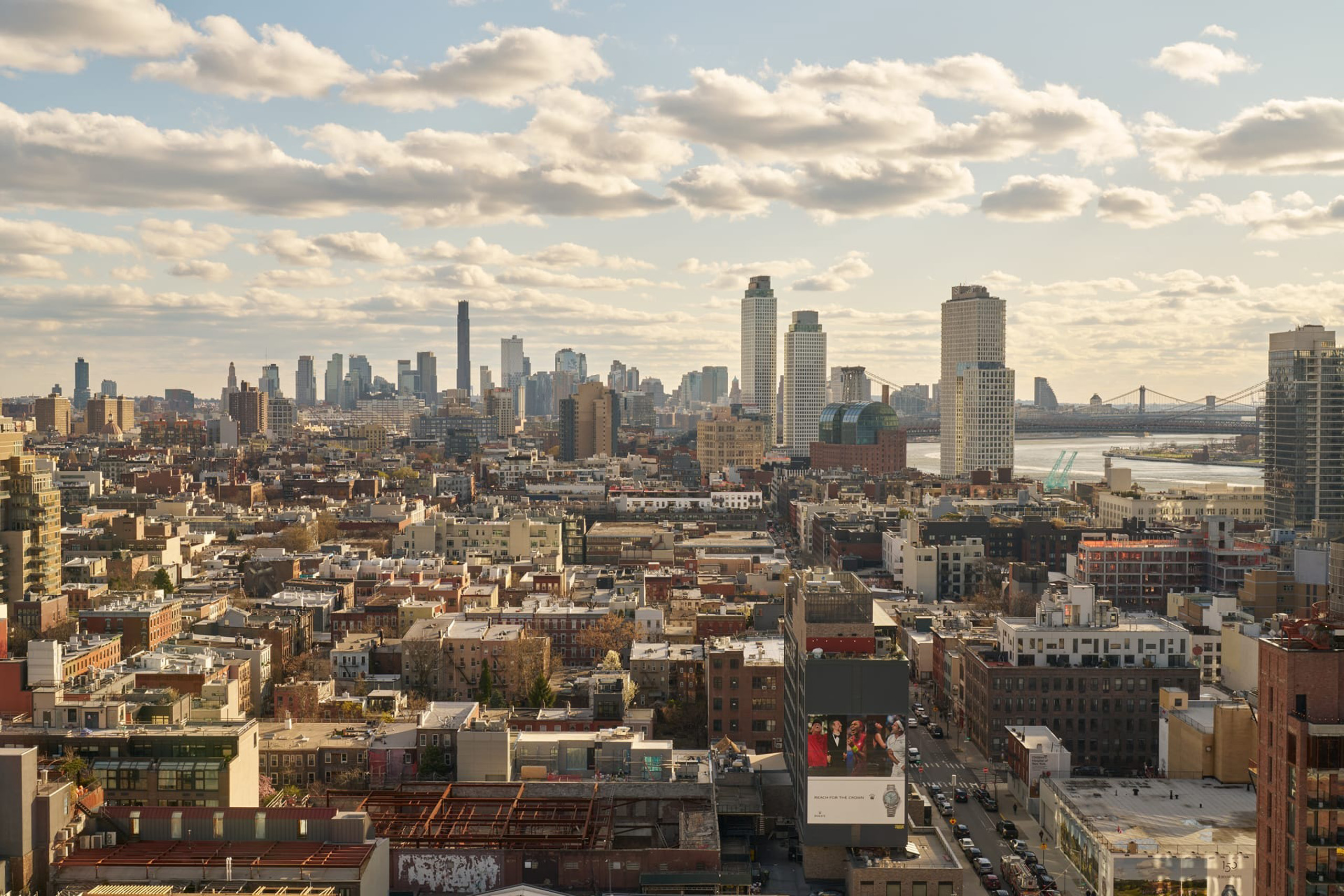 Urban skyline view with buildings and cloudy sky.