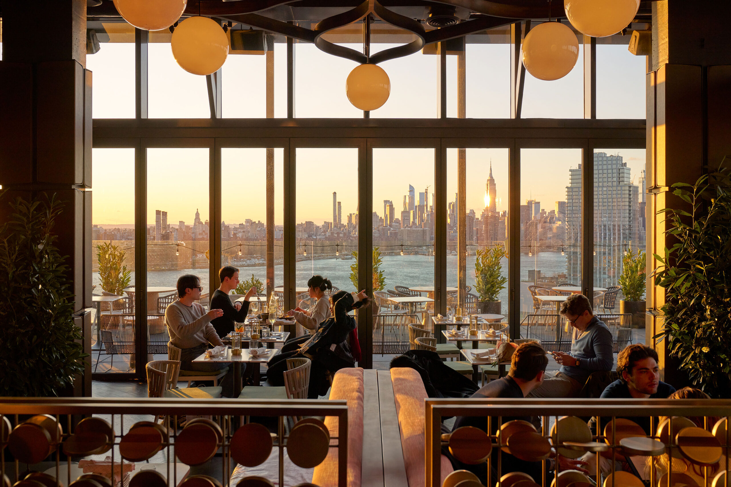 Elegant restaurant with city skyline view.