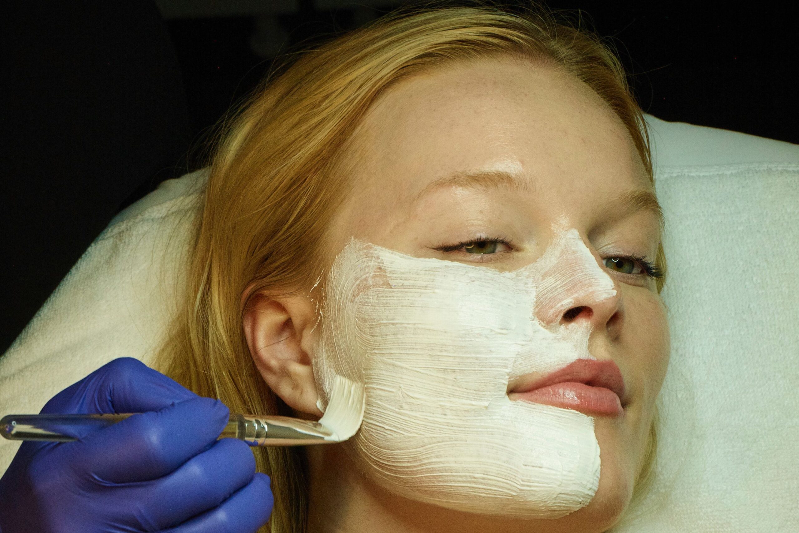 Person receiving a skincare treatment.