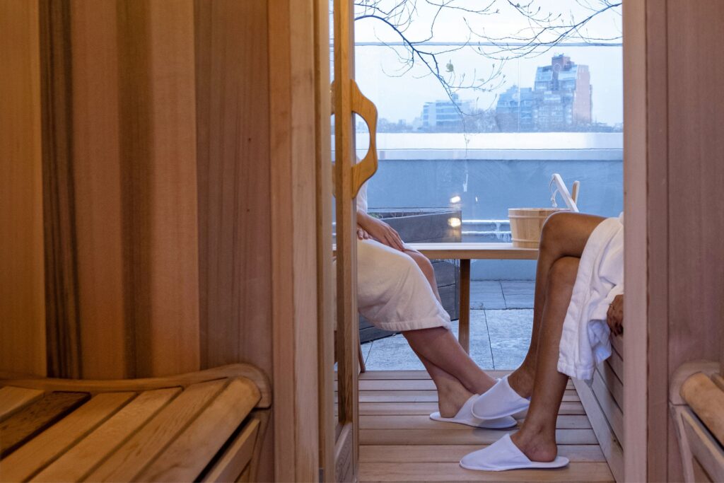 Two people relaxing in sauna