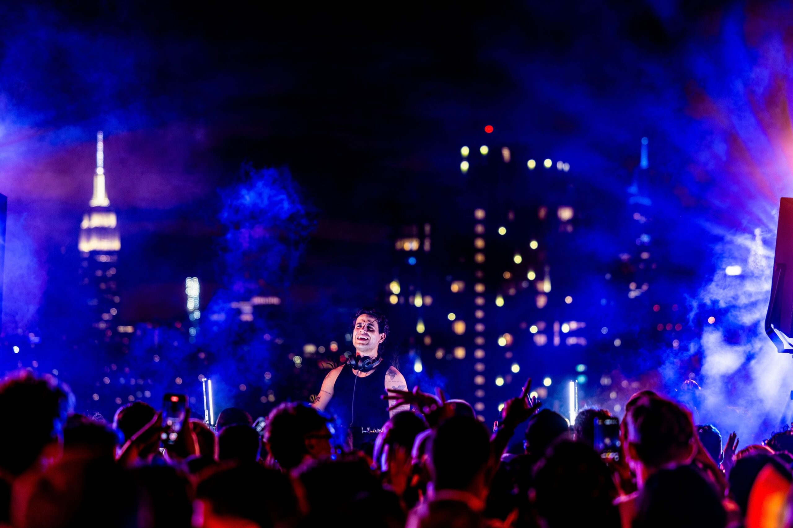 DJ plays set at rooftop bar.