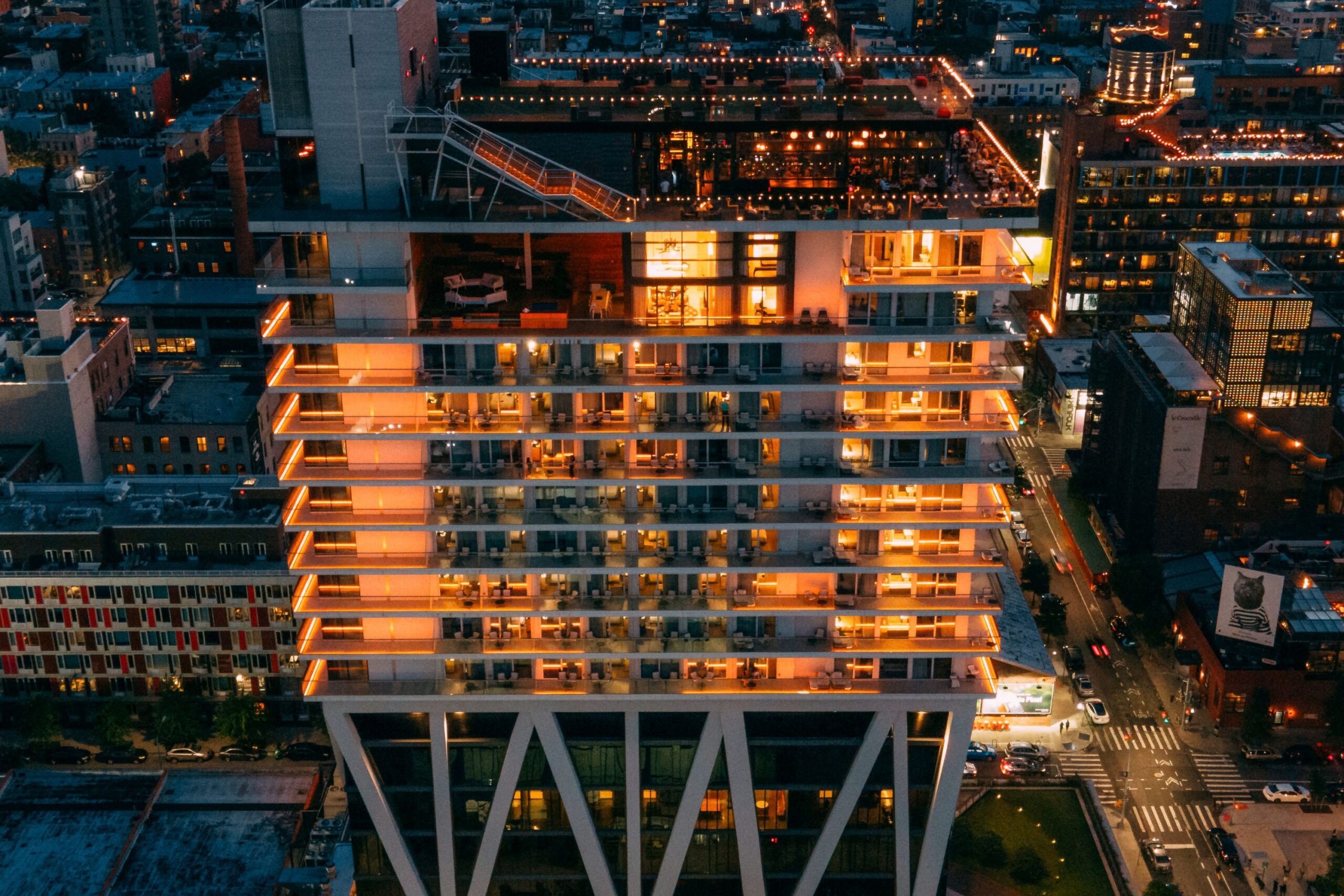 The William Vale illuminated at night aerial shot