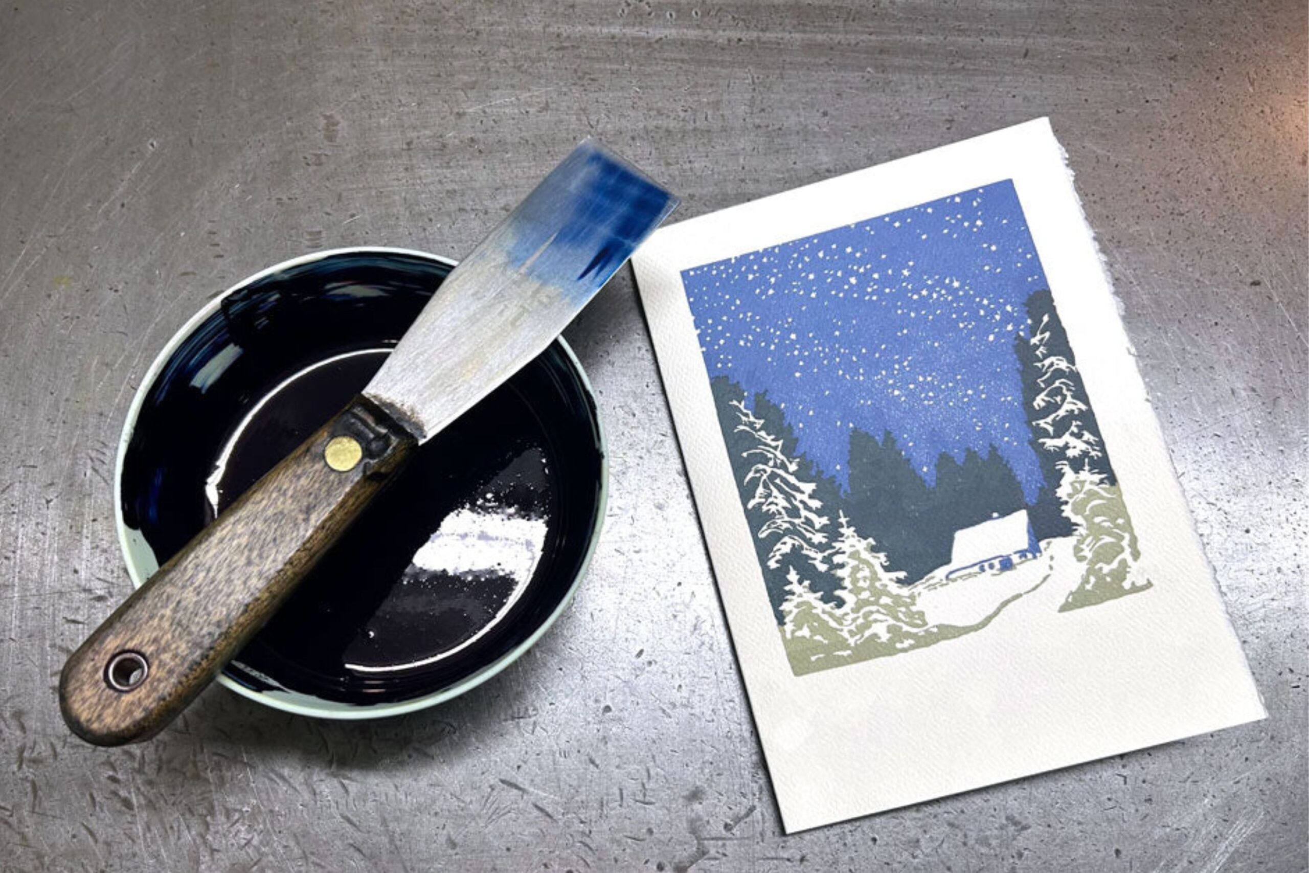 Saturn Press Drift card with bowl of blue ink next to it