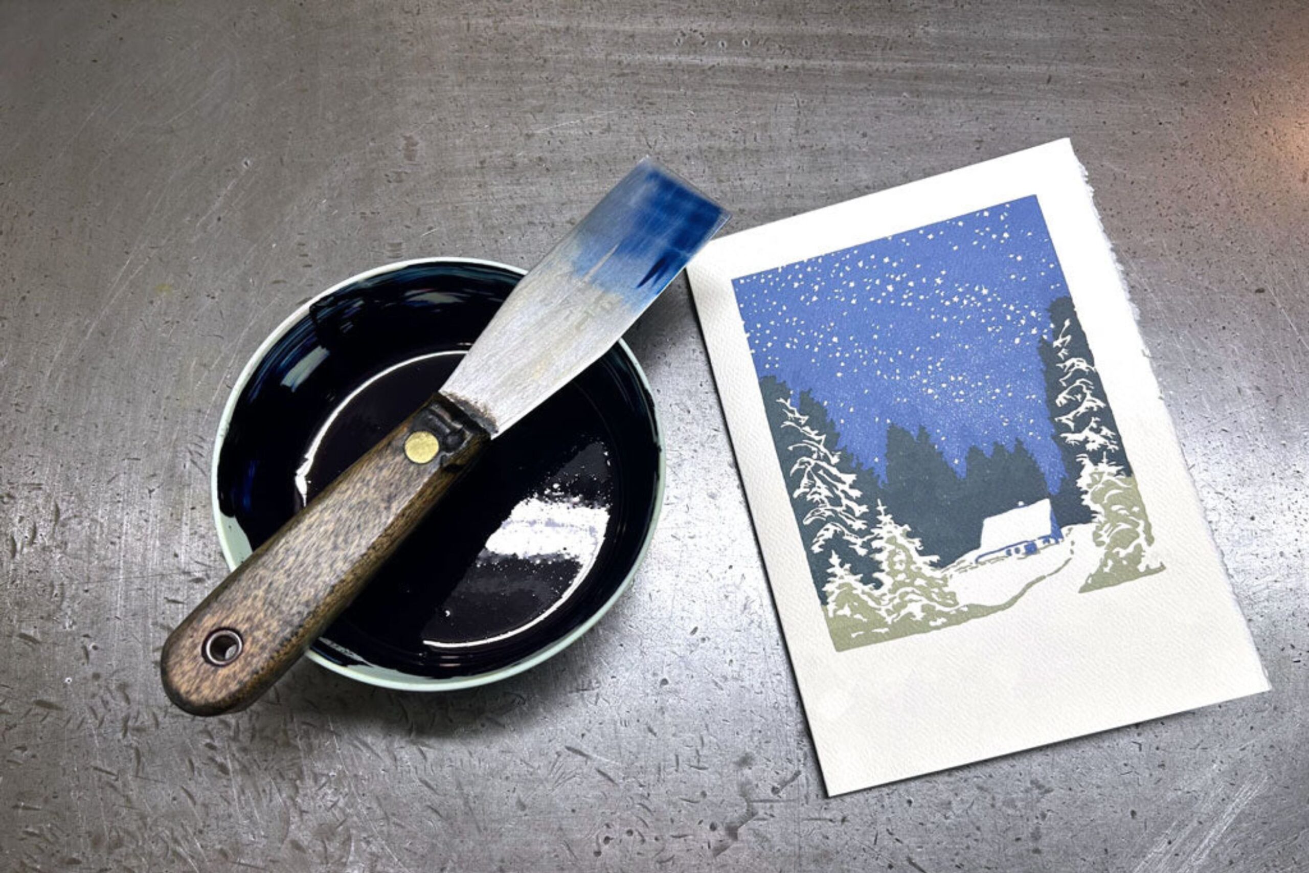 Saturn Press Quiet Night card sits beside a bowl of blue ink.