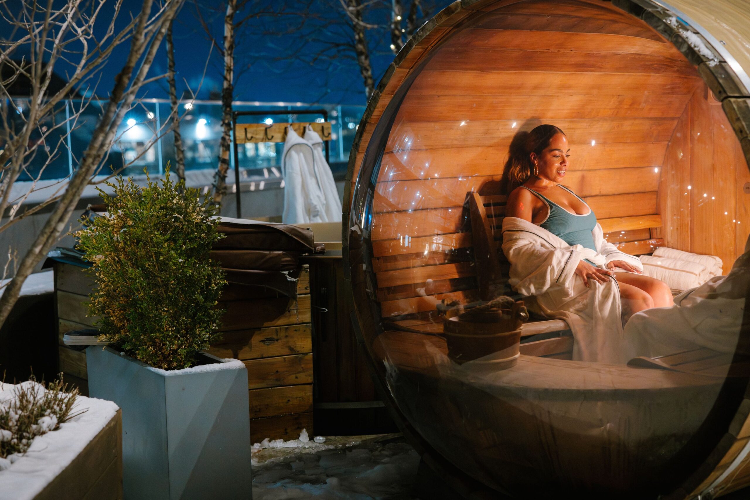 Guest sweats in barrel sauna.