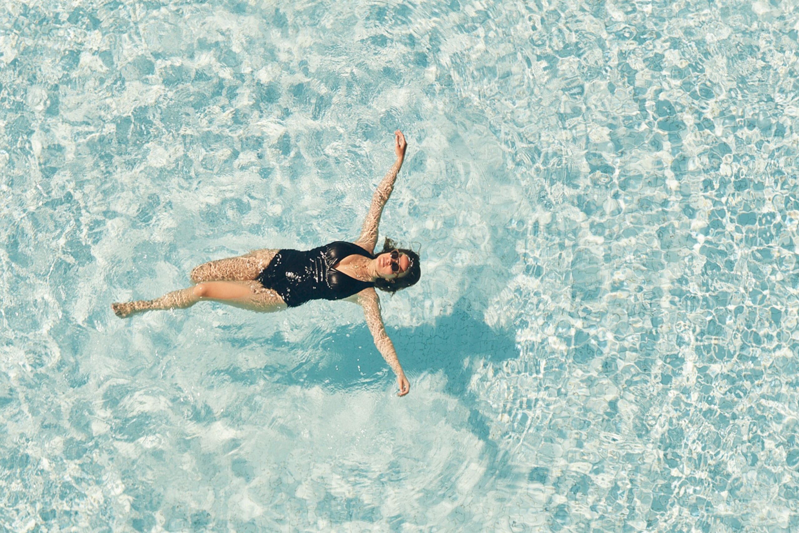 Guest floats in Vale Pool on a hot summer day.