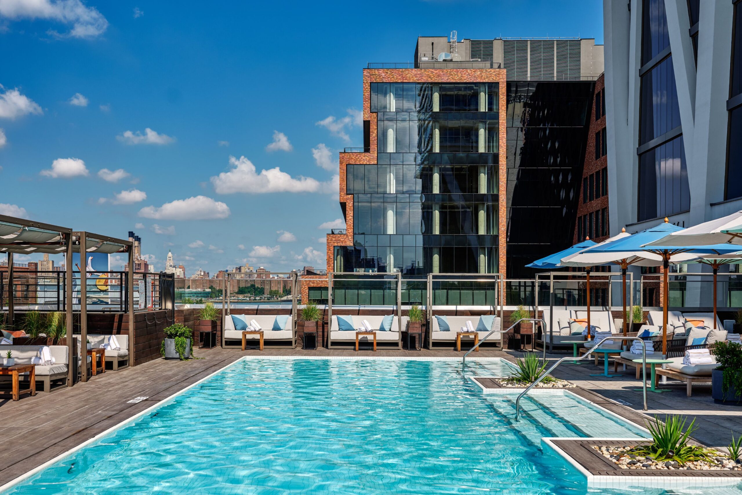 Vale Pool glows in the sunlight. Seating surrounds the pool on the pool deck.