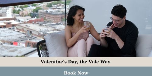 Couple laughs on private balcony.