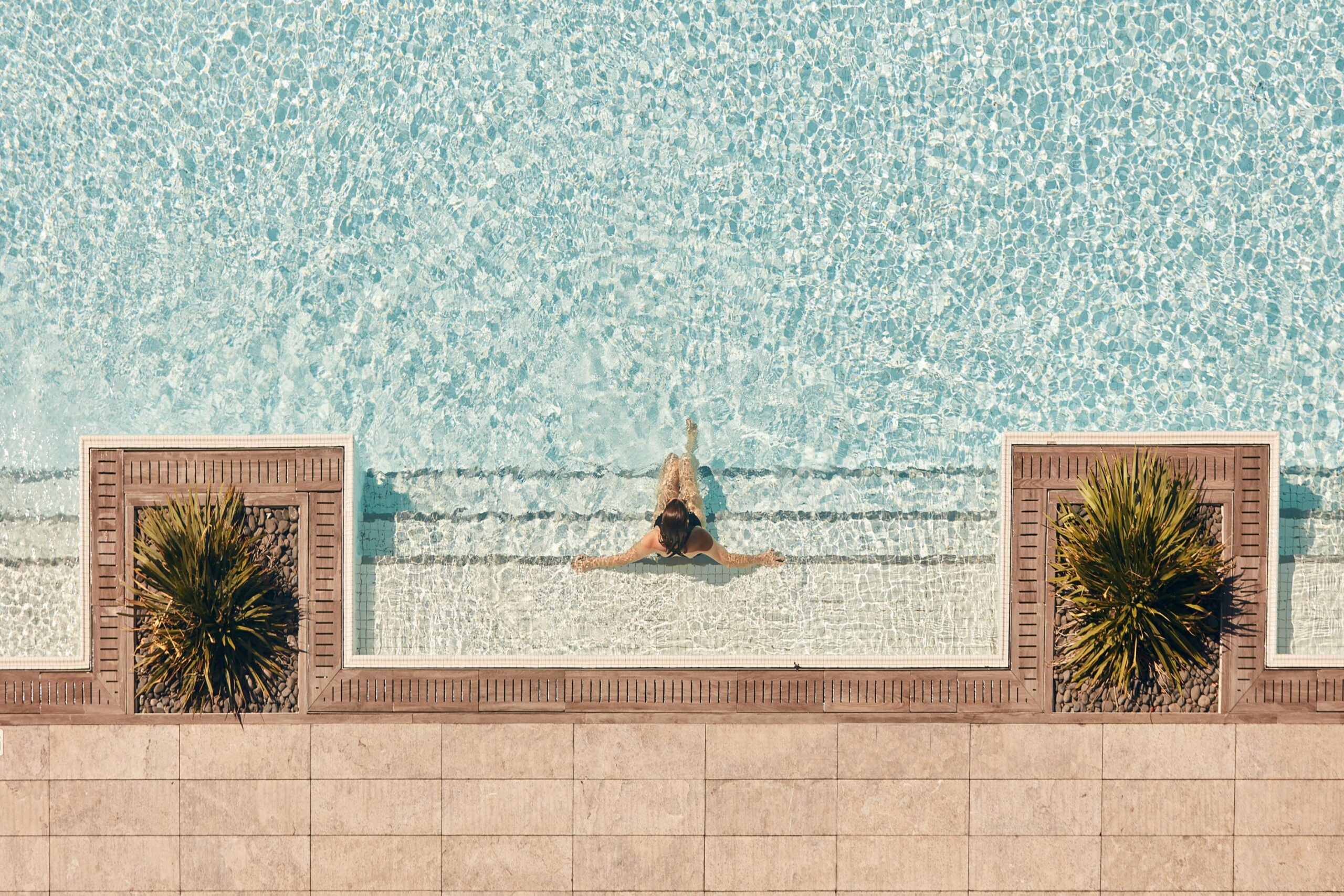 Aerial shot of guest relaxing in Vale Pool