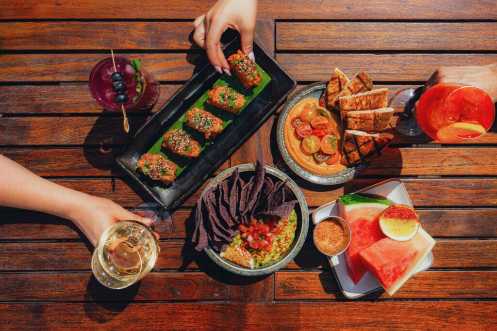 Guests eat and drink from a spread at Vale Pool.