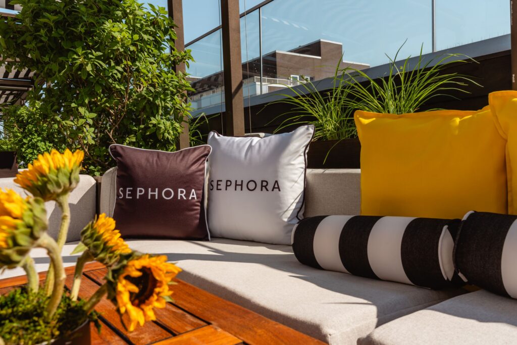 Pillows and sunflowers in cabana at the Sephora Summer Club at The William Vale