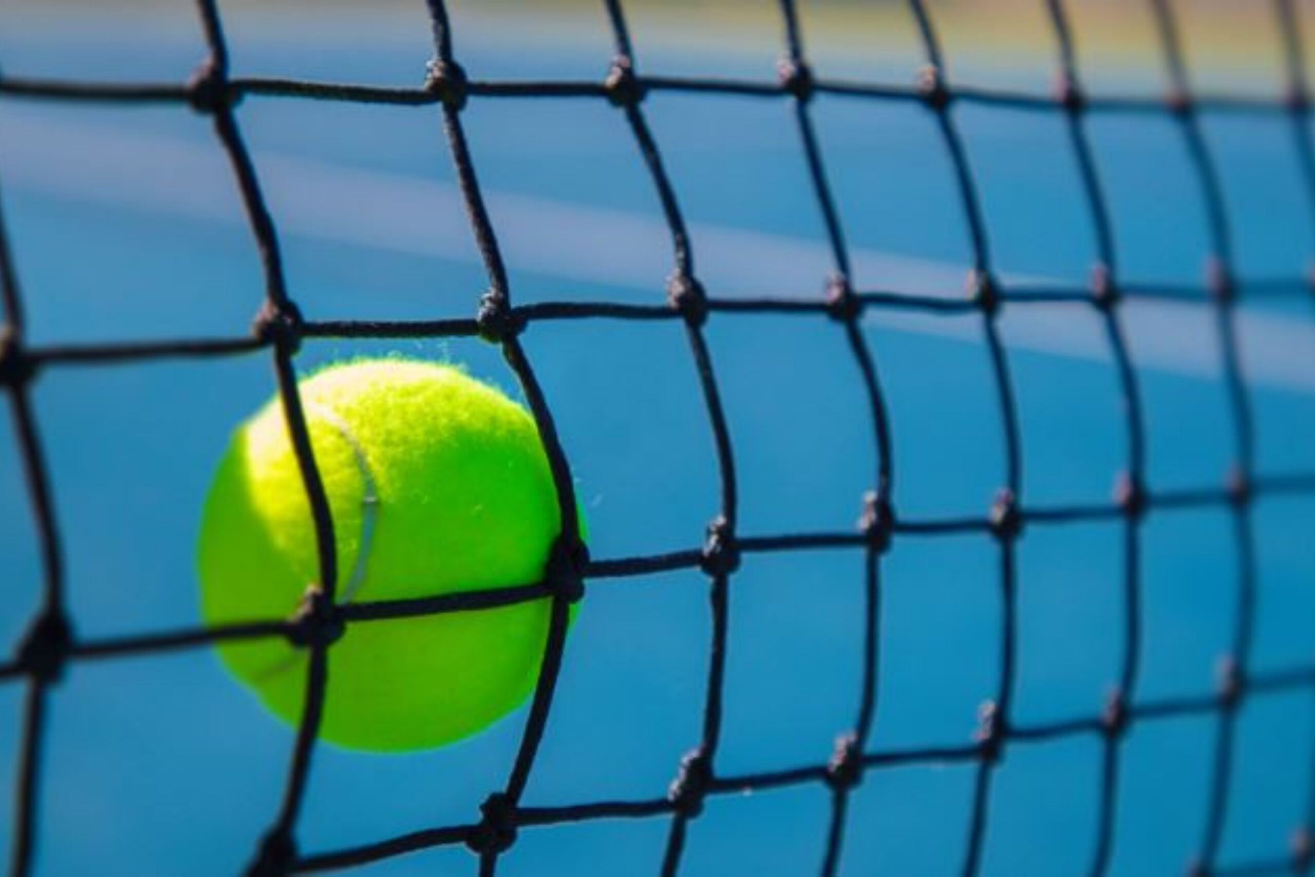 Tennis ball against net