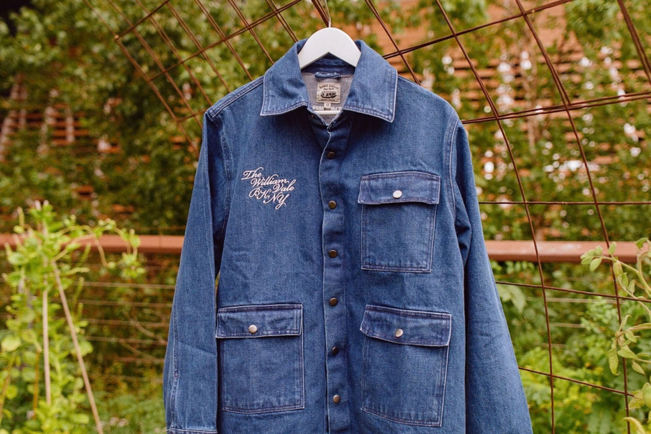Denim jacket hangs in garden.